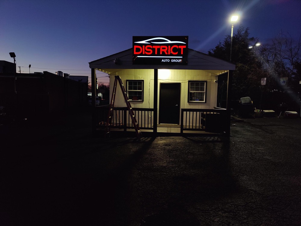 Illuminated sign at dusk