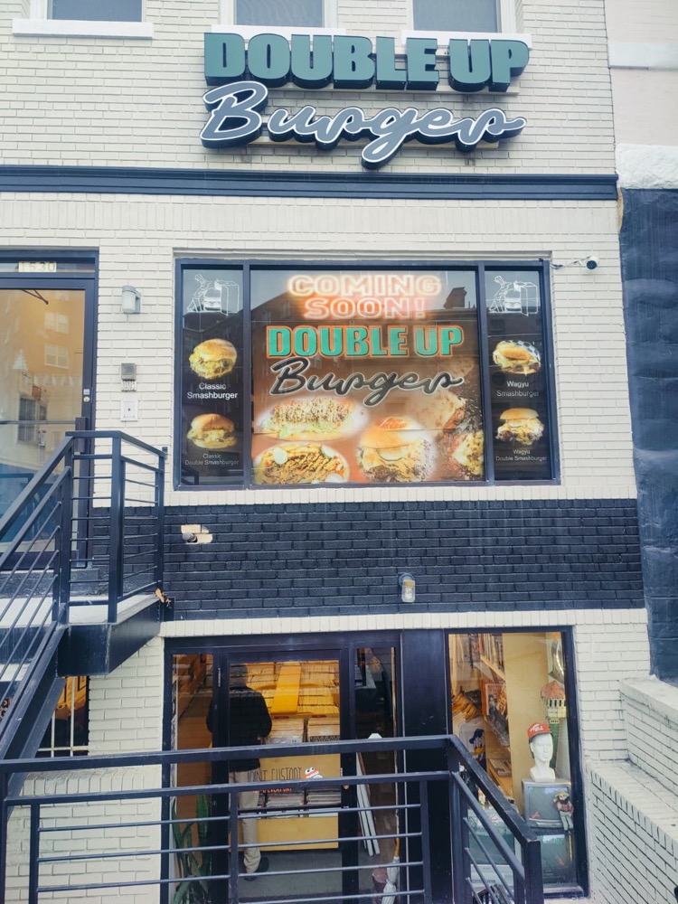 Storefront window graphics at night