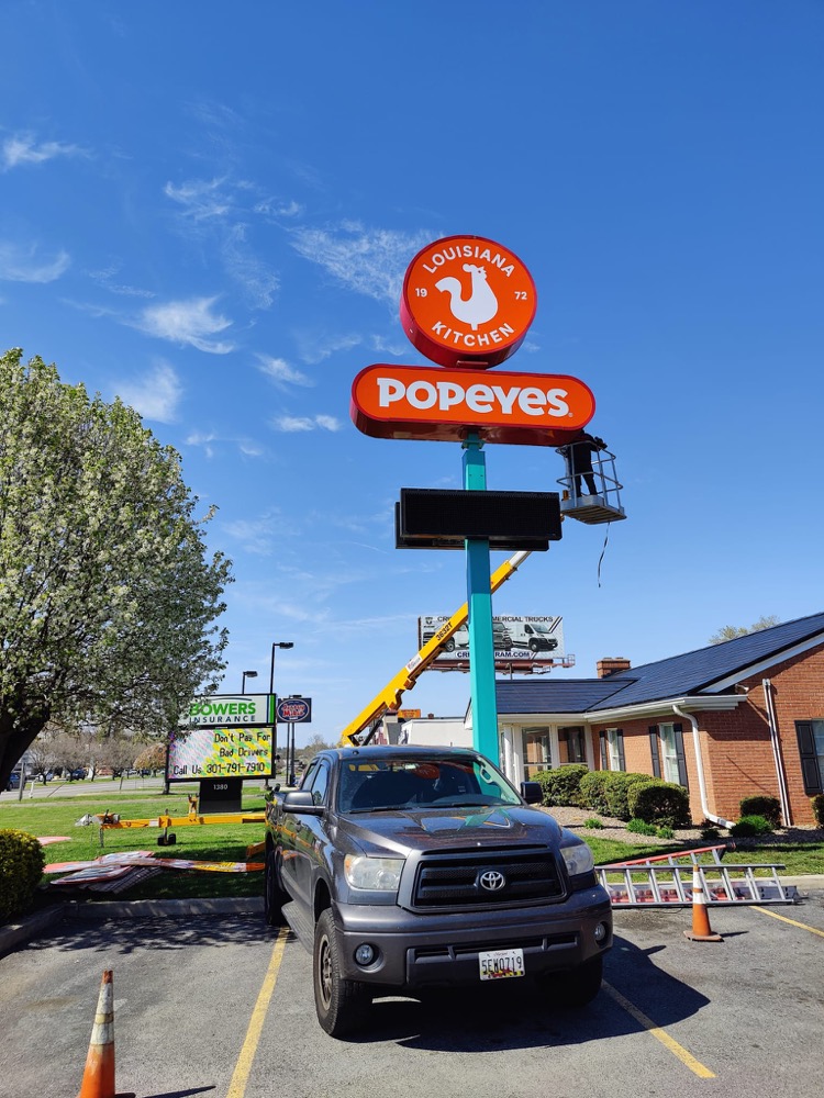 Pylon sign install with lift truck