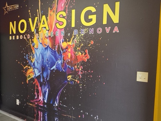 Nova Sign branded wall inside the shop
