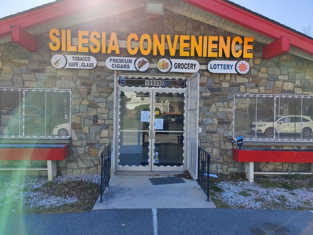 Storefront sign package on stone facade