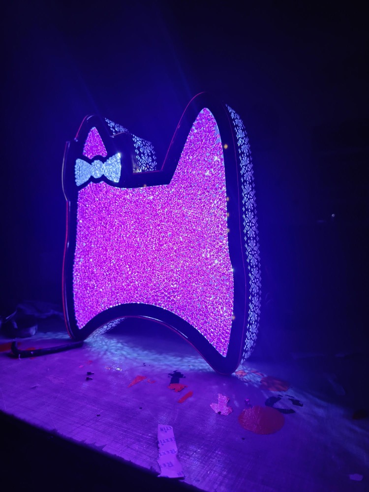 Custom illuminated sign panel in the shop