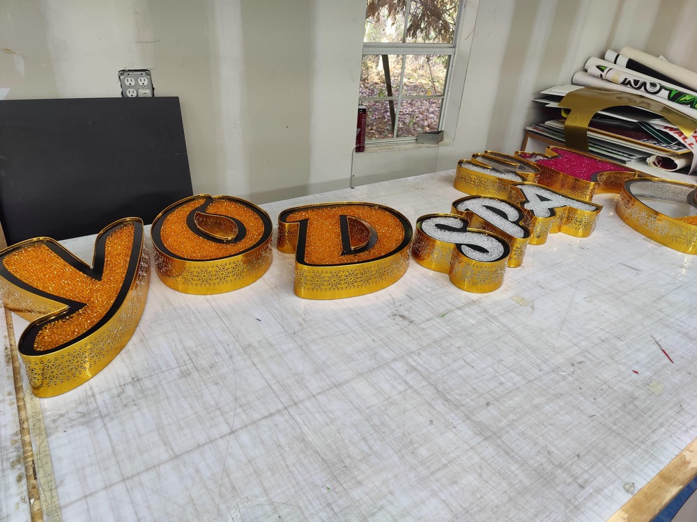 Gold dimensional letters in the shop